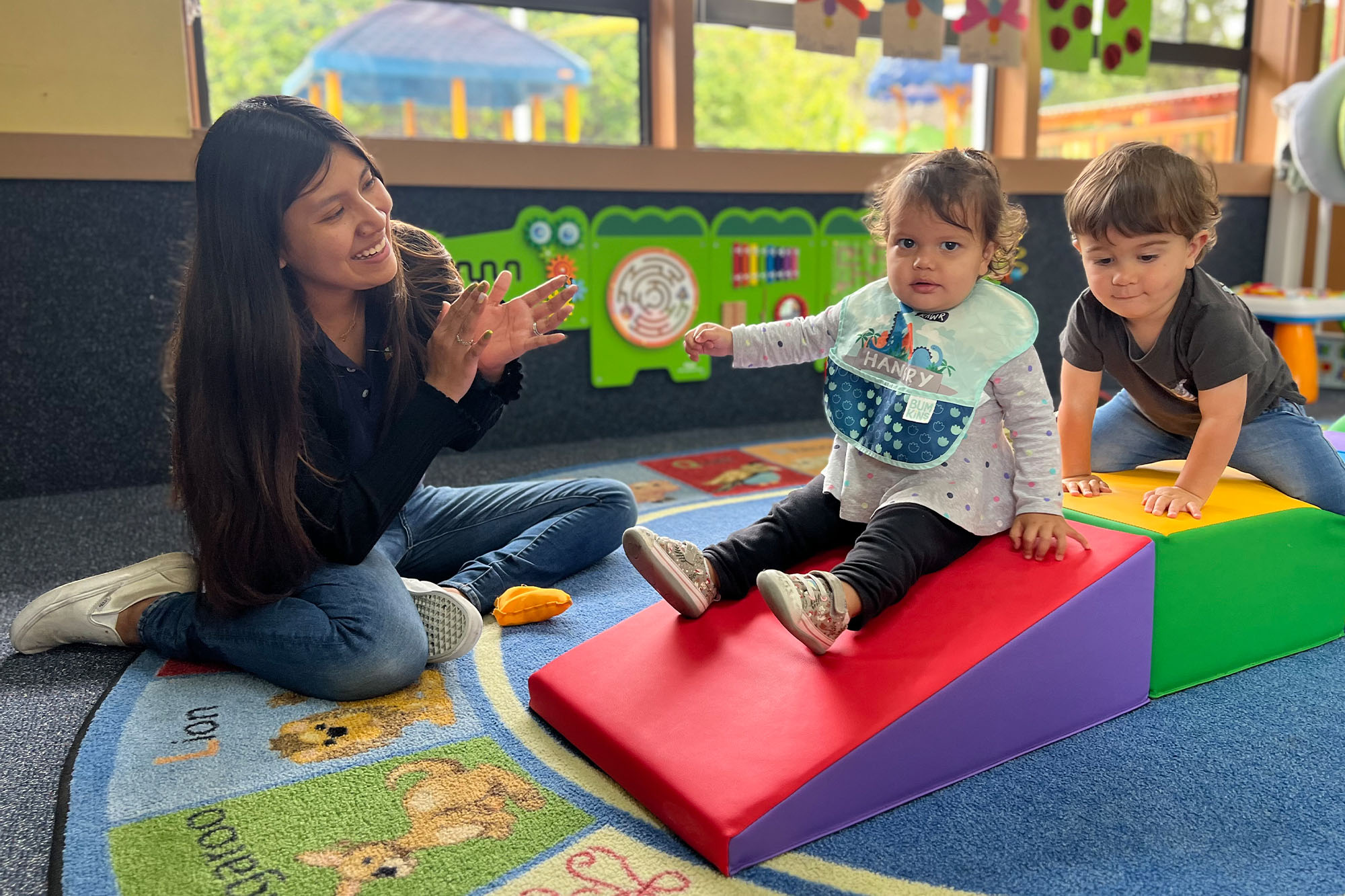 Nurturing caregiver with an infant in the infant room at Academy on the Hills in Aliso Viejo