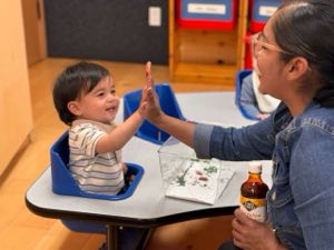Infant at Academy on the Hills in Aliso Viejo, ages 6 weeks to 24 months, receiving nurturing one-on-one care