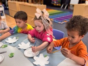 Children in Academy on the Hills' Junior Pre-K program in Aliso Viejo working on a hands-on classroom activity