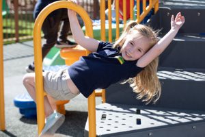 Pre-K child during an active outdoor learning session at Academy on the Hills