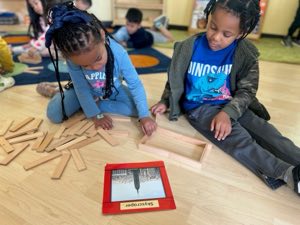 Preschool children working on a hands-on STEAM project at Academy on the Hills