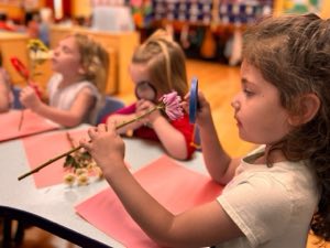 Experienced and caring teachers nurturing toddlers in a safe, secure classroom environment at Academy on the Hills